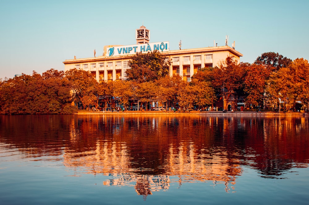 a large building sitting on top of a lake