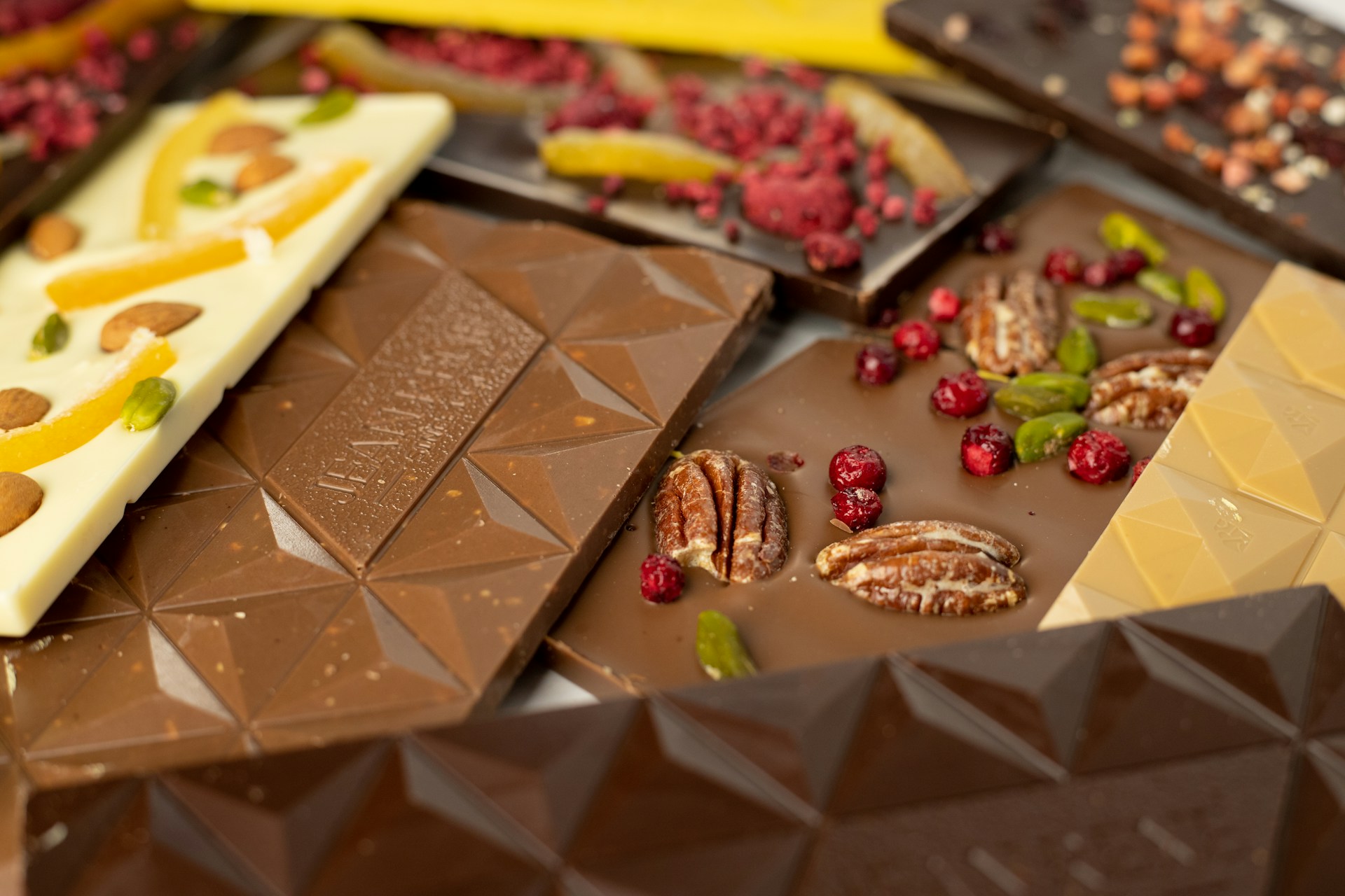 a variety of chocolates and nuts on a table