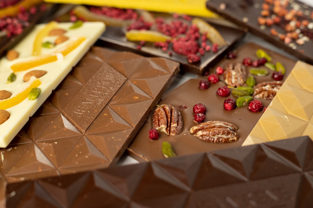 a variety of chocolates and nuts on a table,