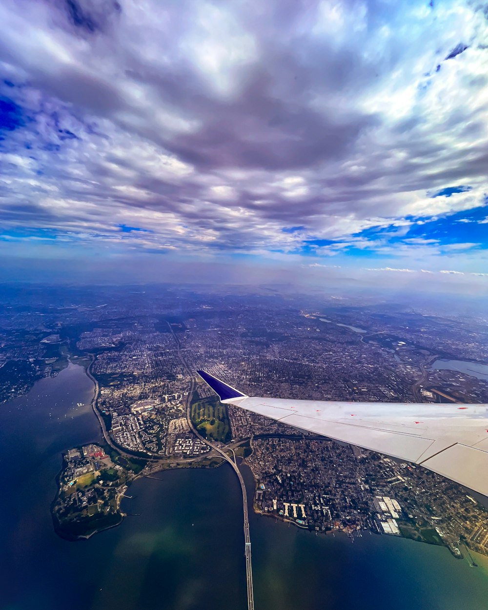 an aerial view of a city and a body of water