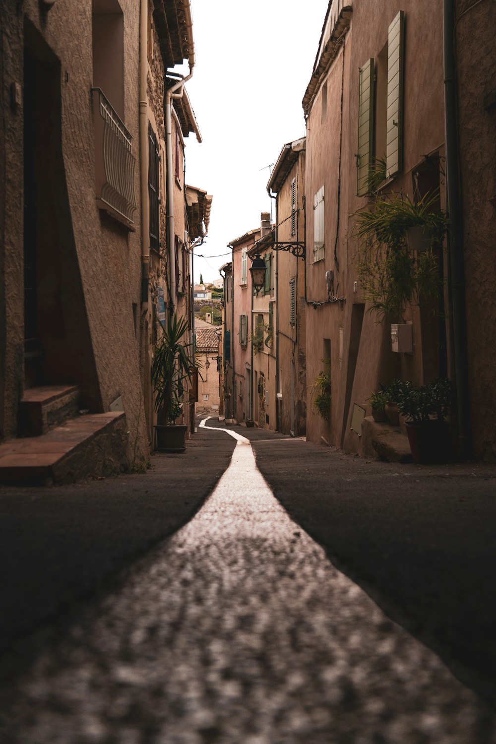 a narrow street with buildings on both sides