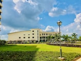 A bright morning view of the Moroccan law faculty building with students walking in front