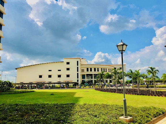 A bright morning view of the Moroccan law faculty building with students walking in front