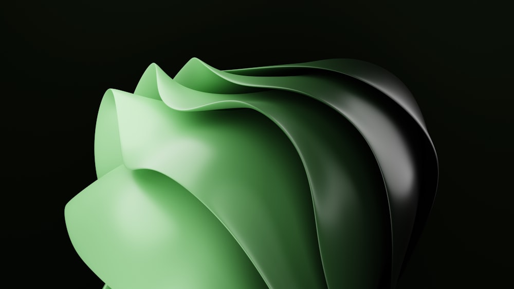 a close up of a green object on a black background
