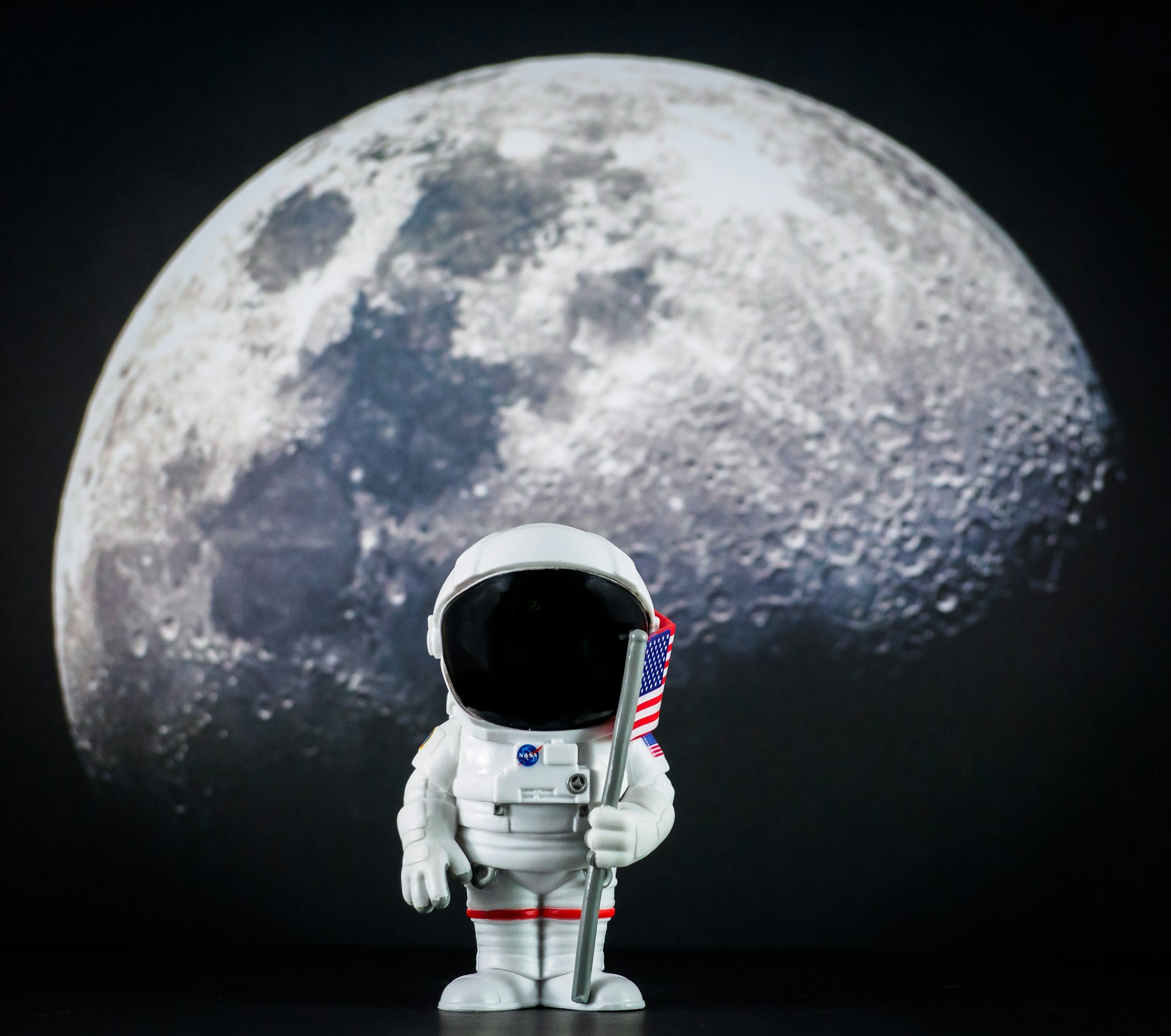 Astronaut with flag on the moon