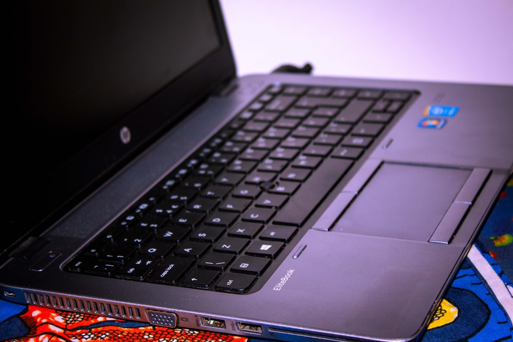 a laptop computer sitting on top of a table