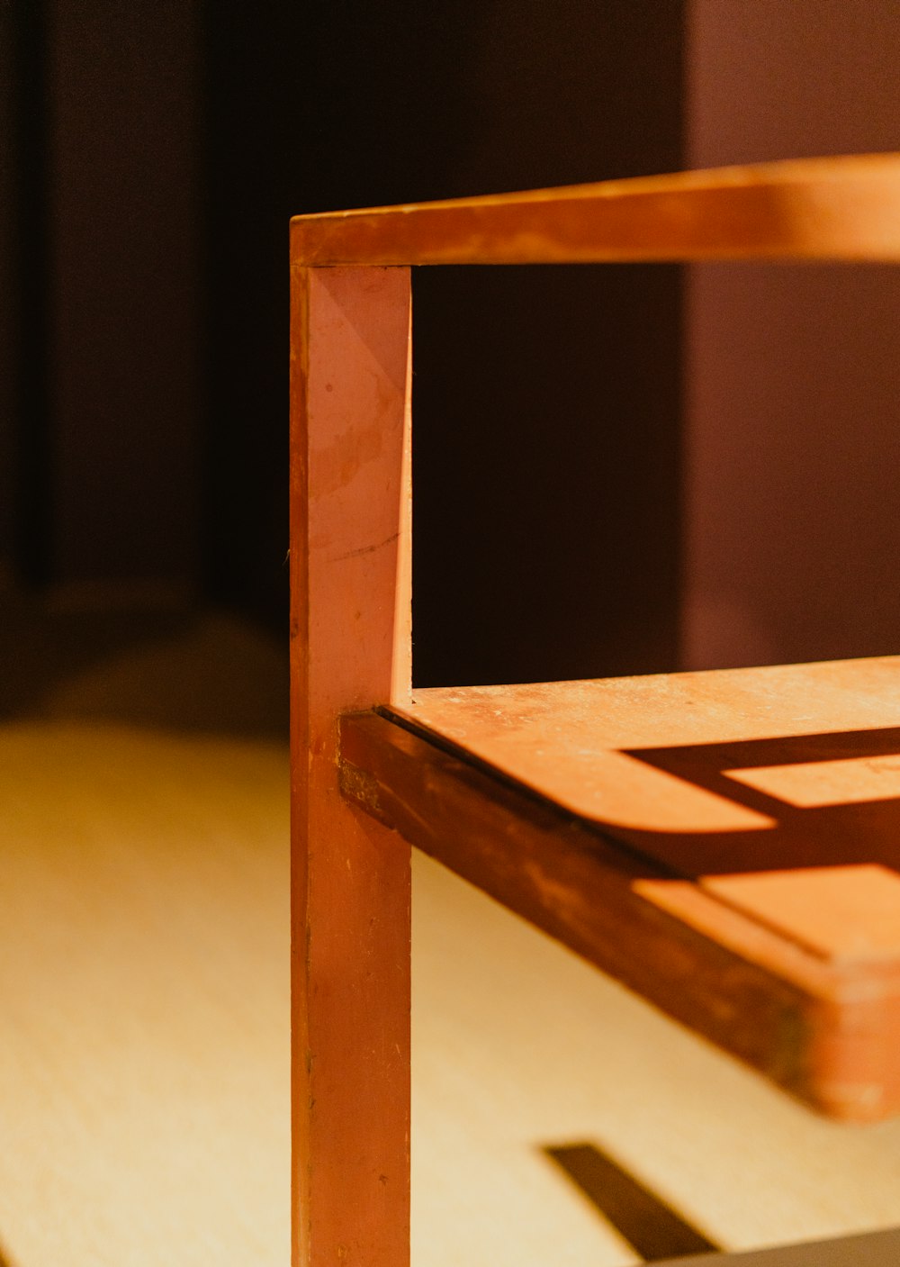 a wooden chair sitting on top of a hard wood floor