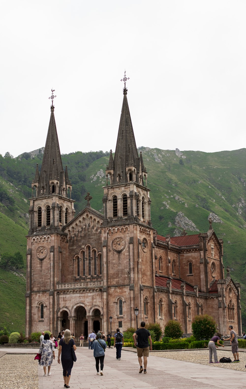 a group of people walking in front of a church