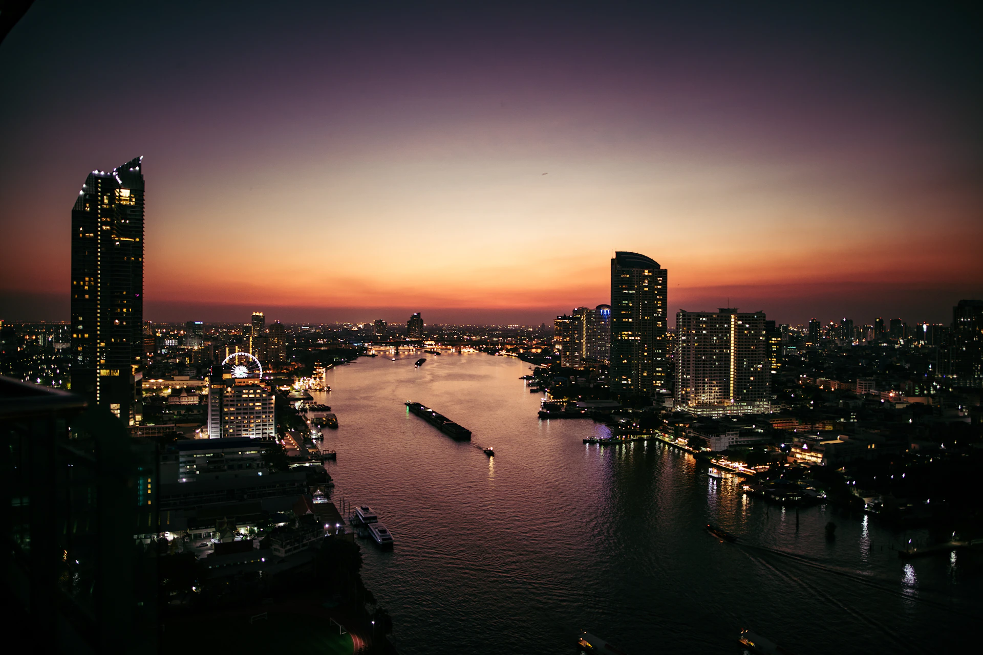 a view of a city and a river at night