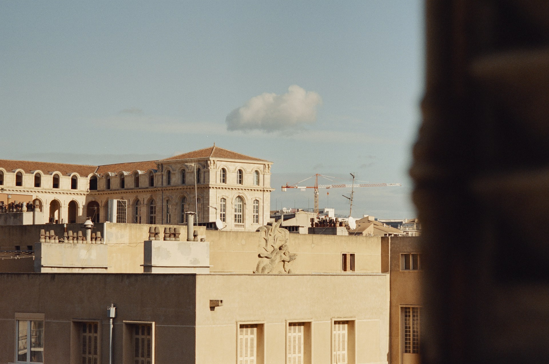 woman wearing yellow long-sleeved dress under white clouds and blue sky during daytime