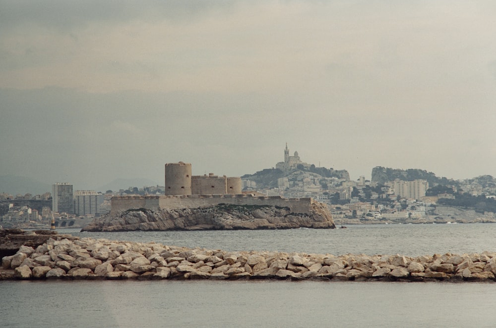 a large body of water with a city in the background