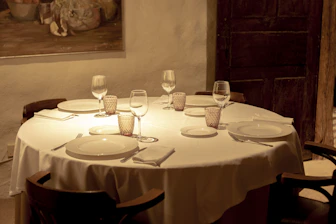 A stylish dining table set with chairs arranged for a family meal.