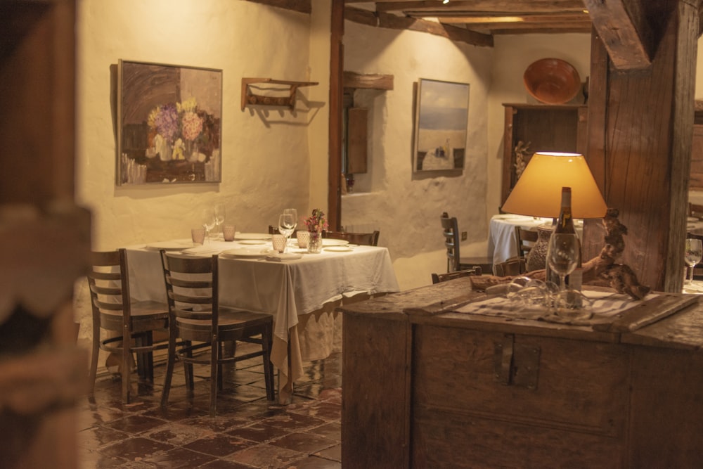 a dining room with a table and chairs