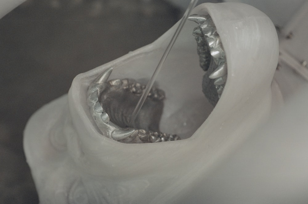 a close up of a tooth with a toothbrush in it