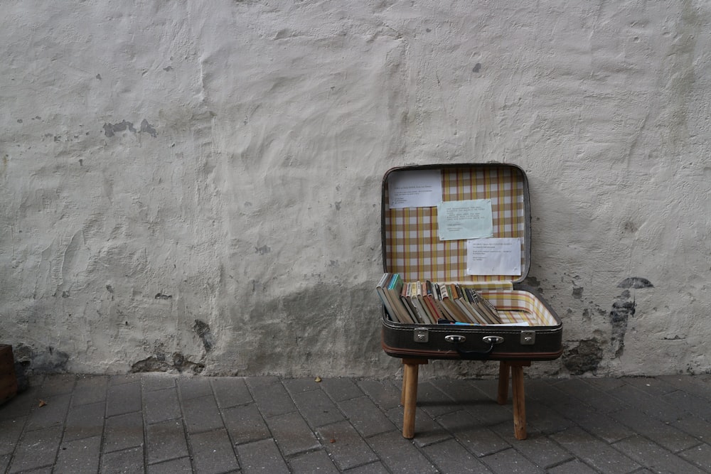 a piece of luggage sitting on top of a wooden table