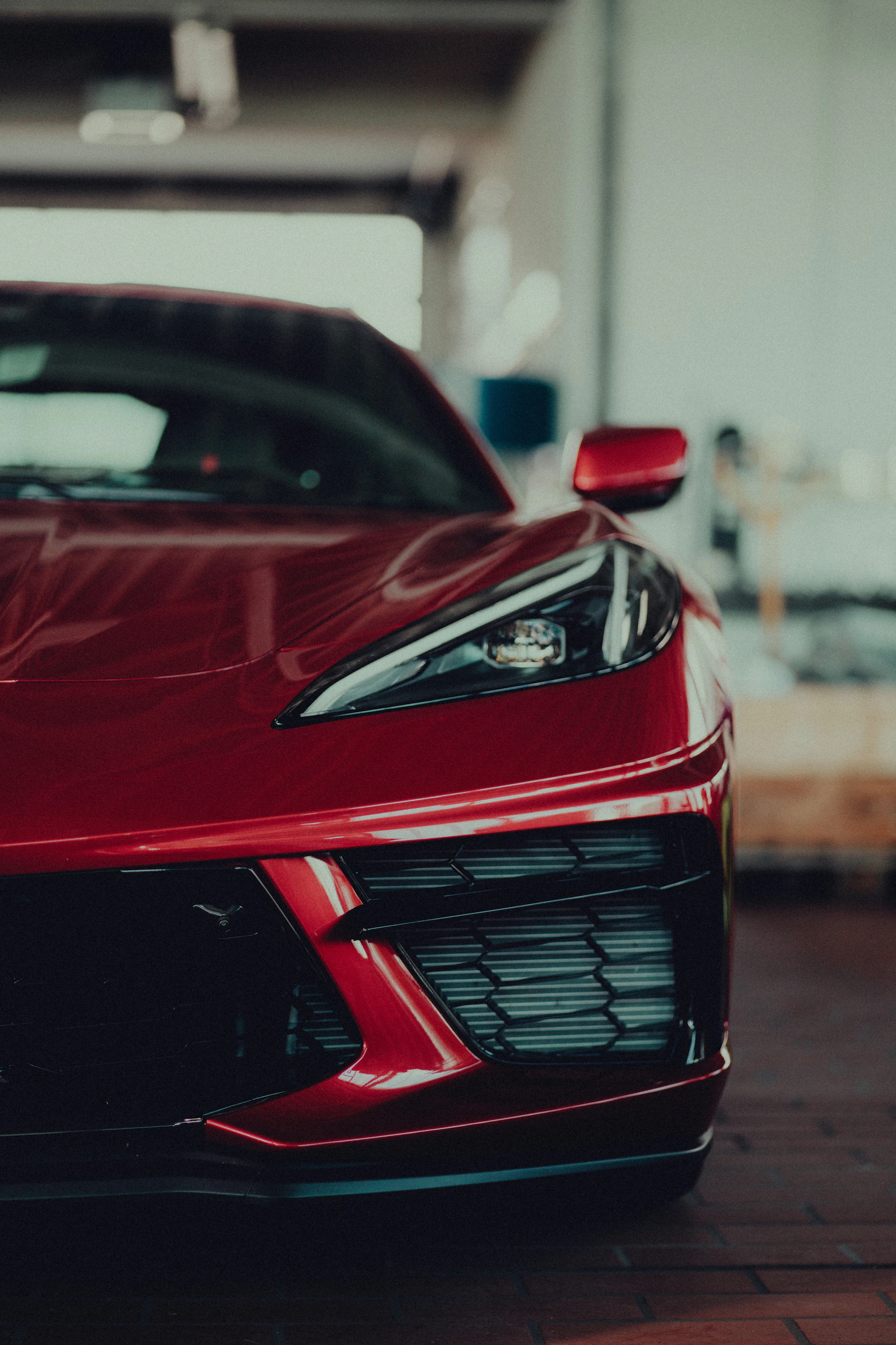 Red Corvette sports car in garage