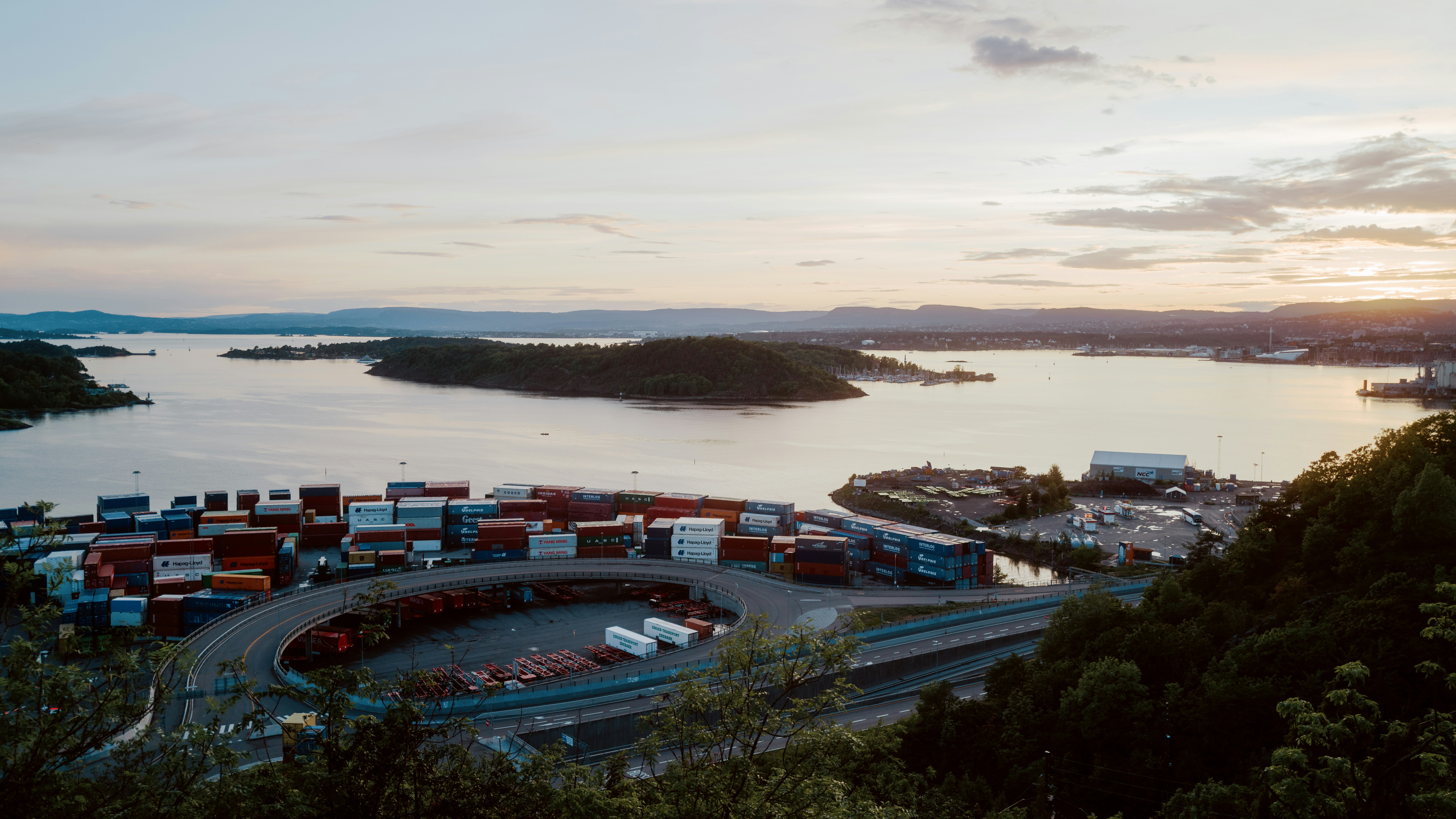 an aerial view of a harbor with a lot of containers