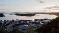A scenic view of a shipping container yard at sunset.