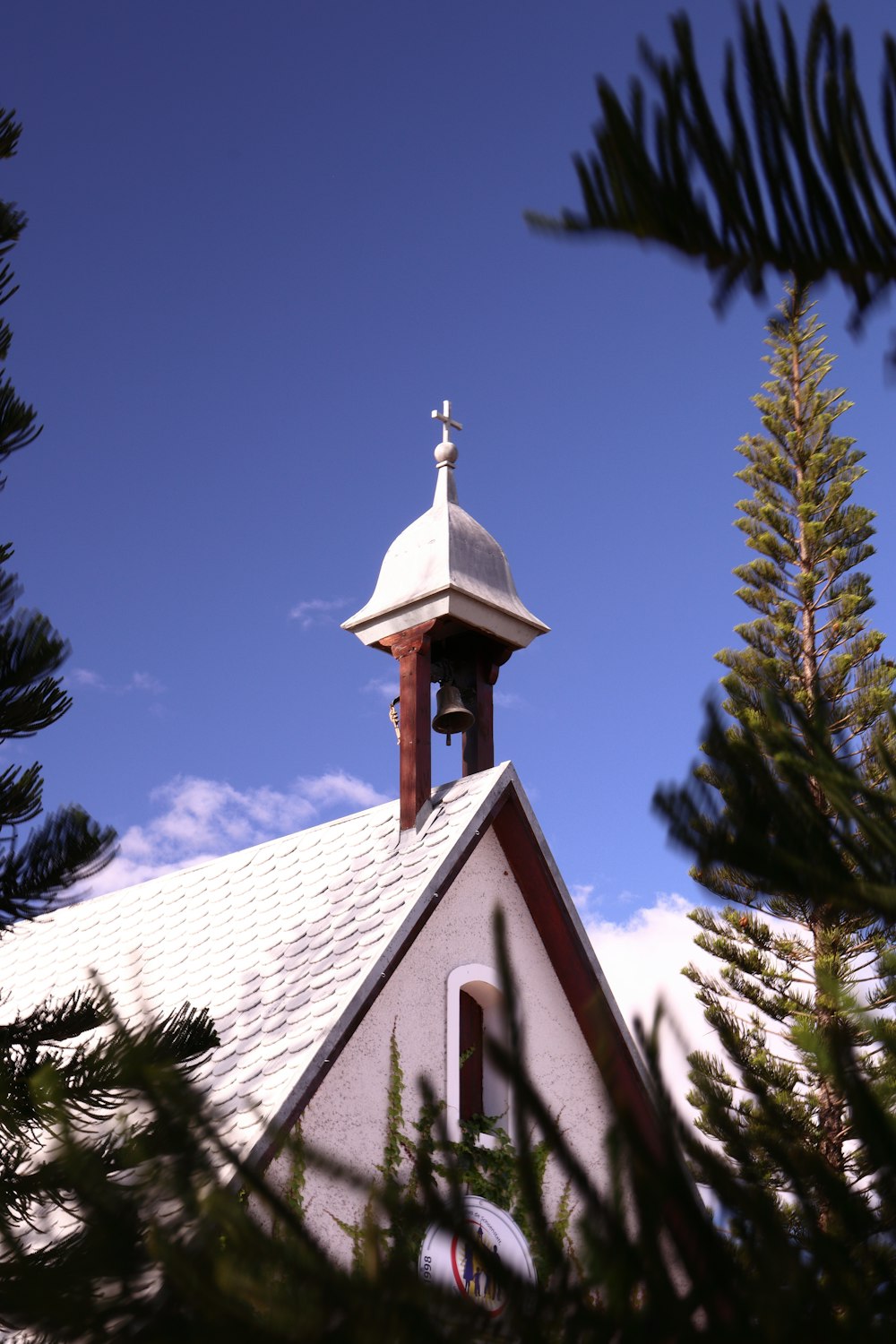 a church steeple with a cross on top of it