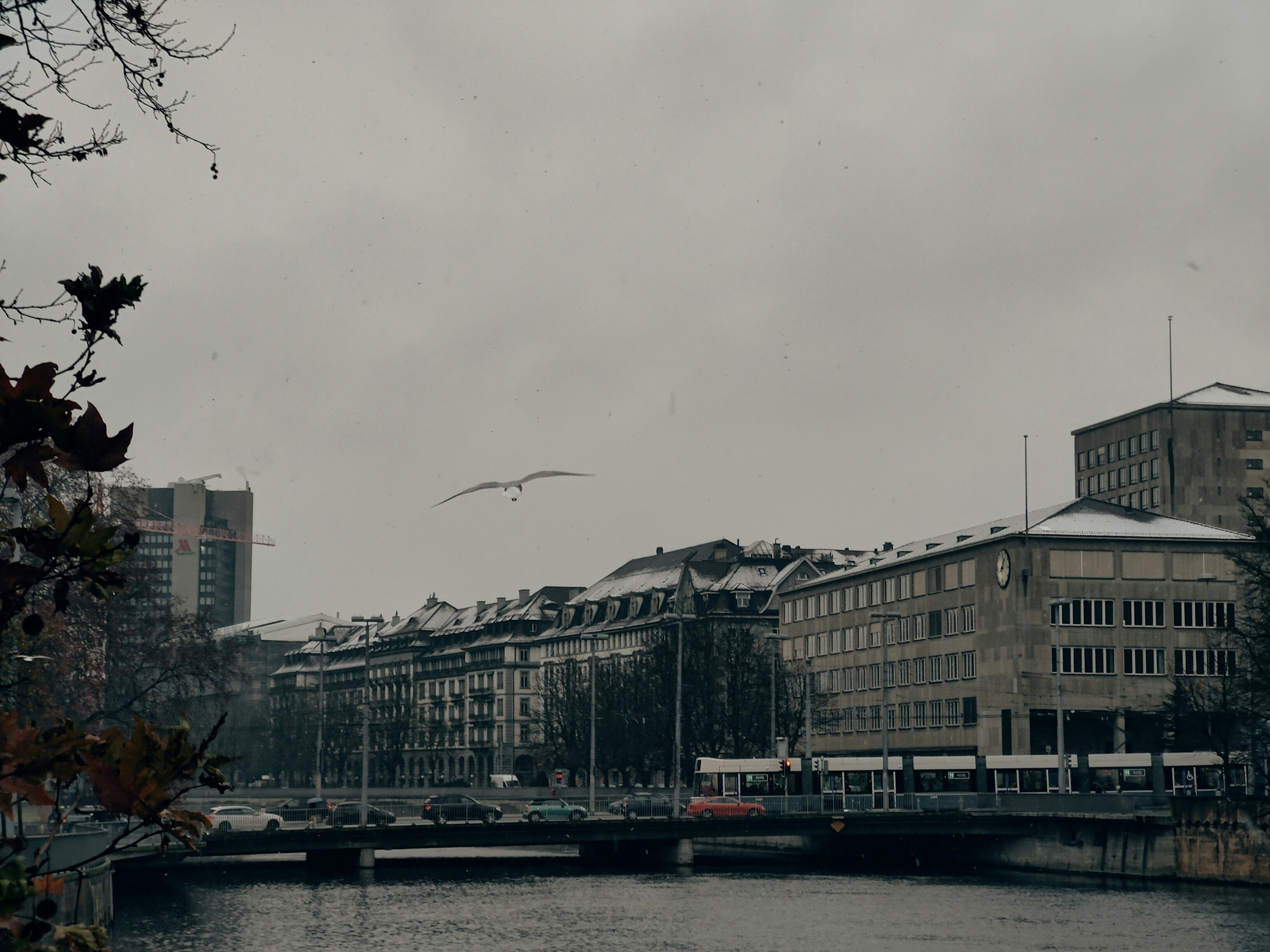 a river running through a city next to tall buildings