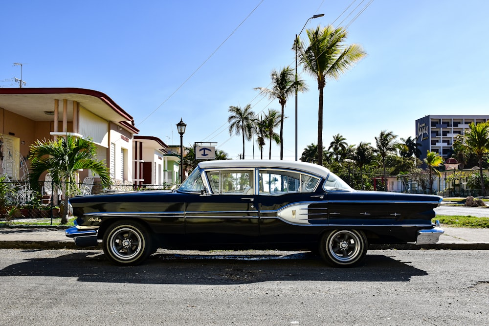 a classic car parked on the side of the road