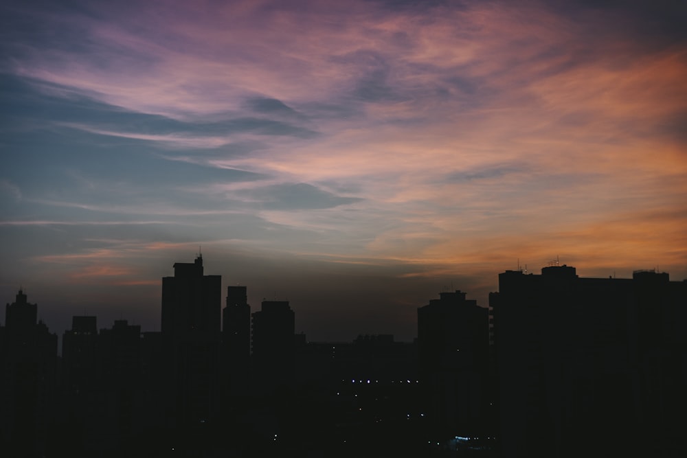 a view of a city skyline at sunset