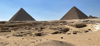 A stunning view of the Great Pyramids of Giza under a clear blue sky.