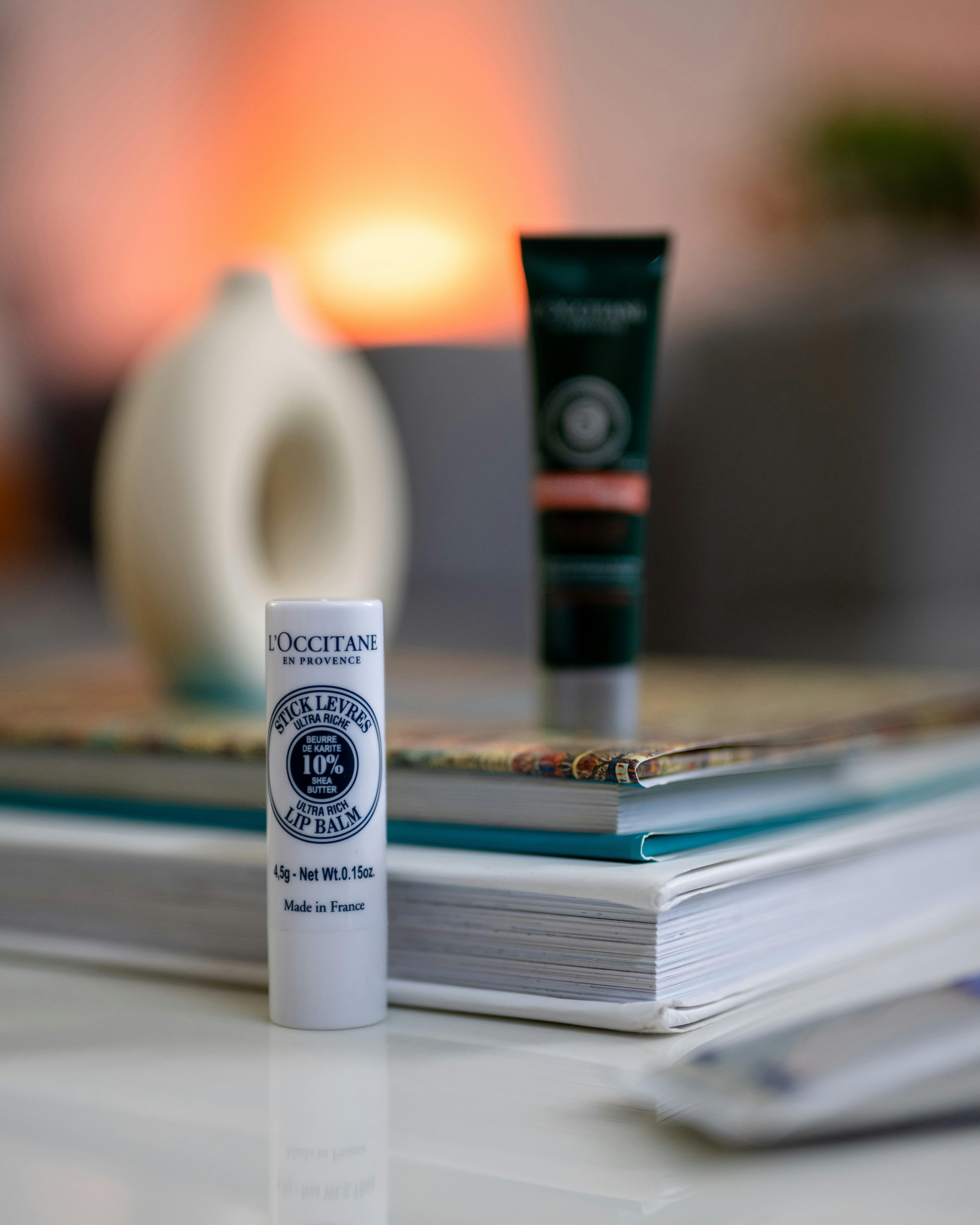 a tube of lip balm sitting on top of a table