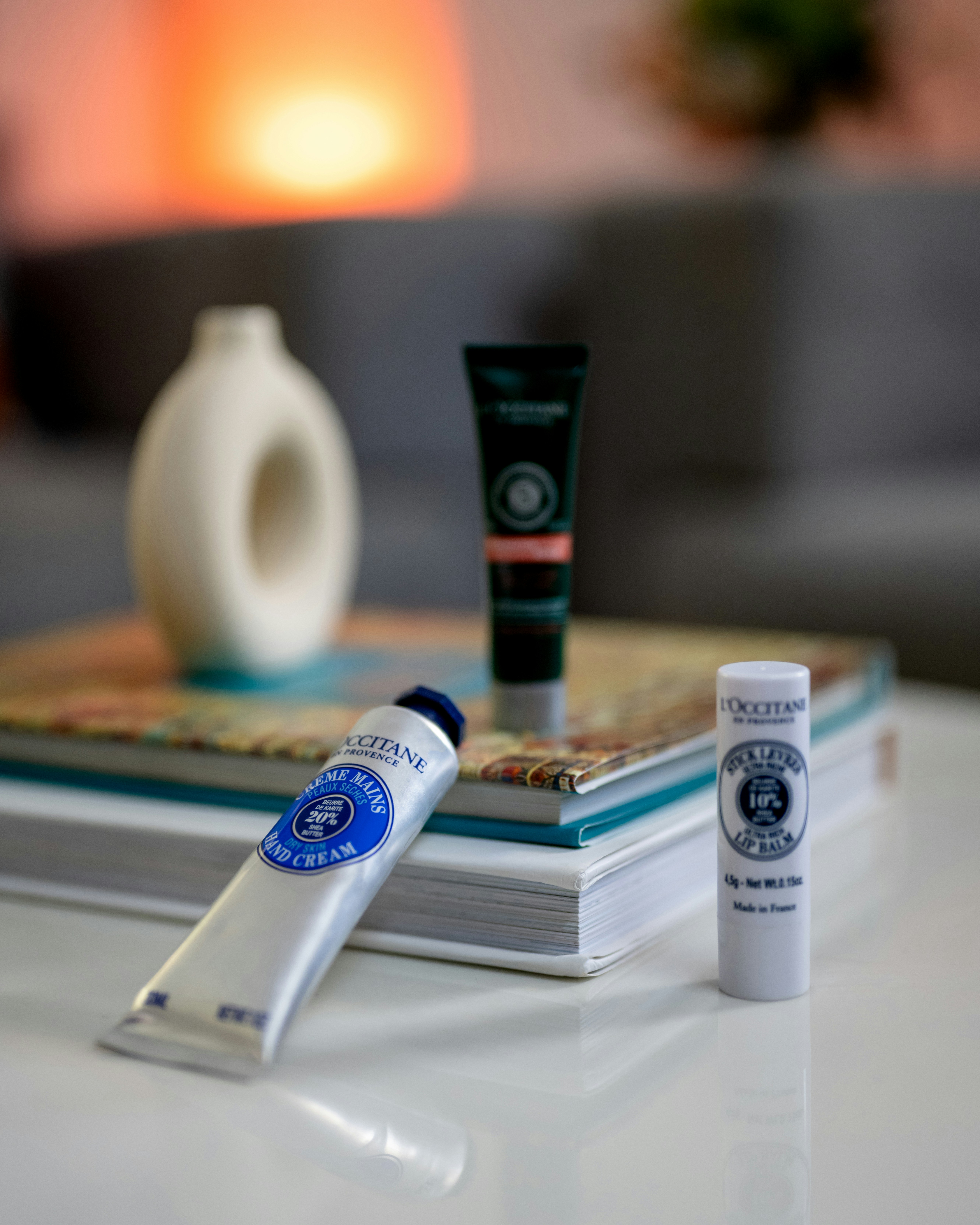 a couple of tubes of toothpaste sitting on top of a table