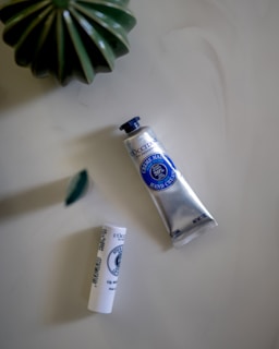 a tube of toothpaste next to a tube of toothpaste