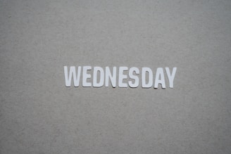 the word wednesday written in cut out letters