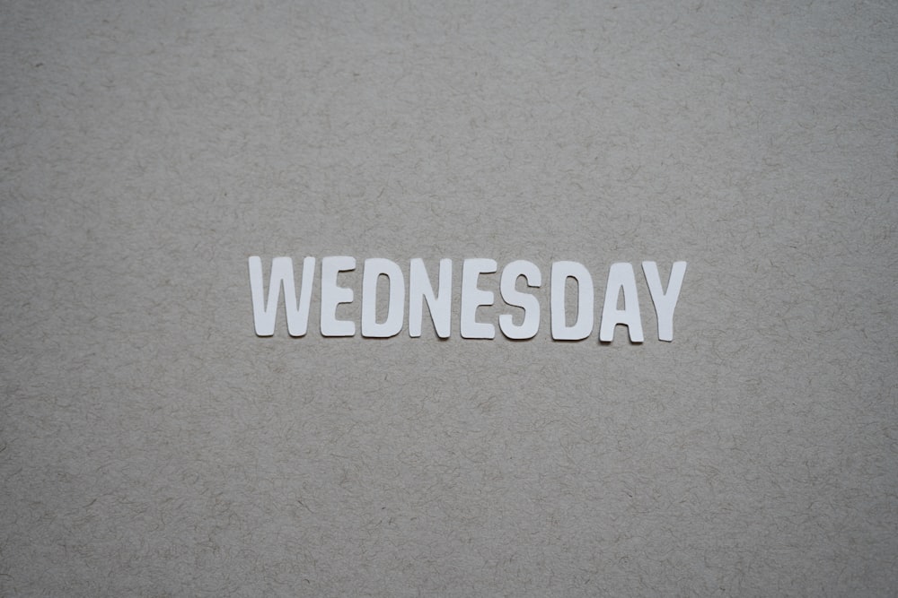 the word wednesday written in cut out letters