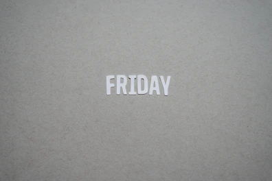 a close up of the word friday written on a piece of paper