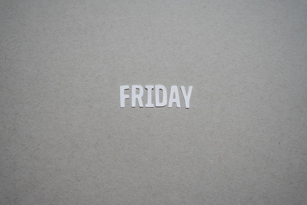 a close up of the word friday written on a piece of paper