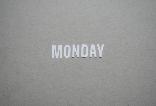 the word monday is cut out of white paper