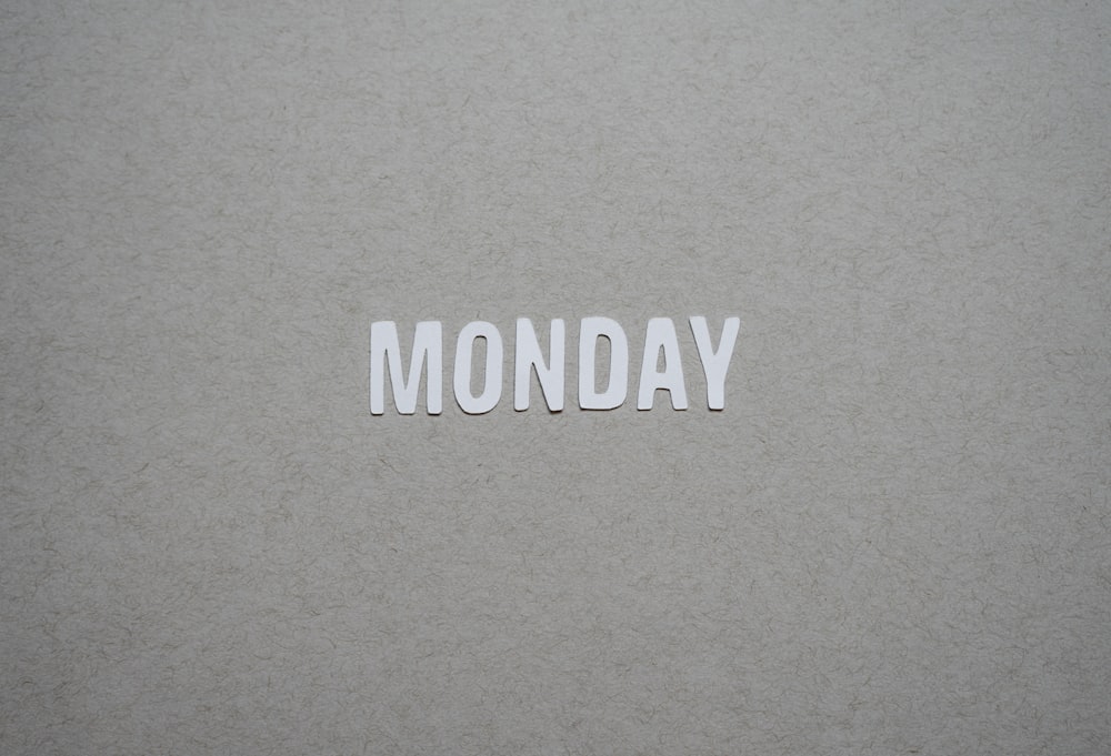 the word monday is cut out of white paper