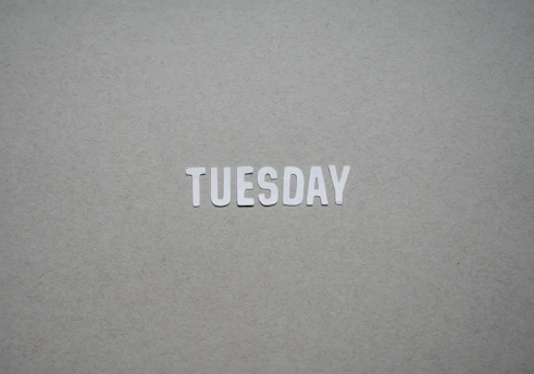 the word tuesday written in cut out letters