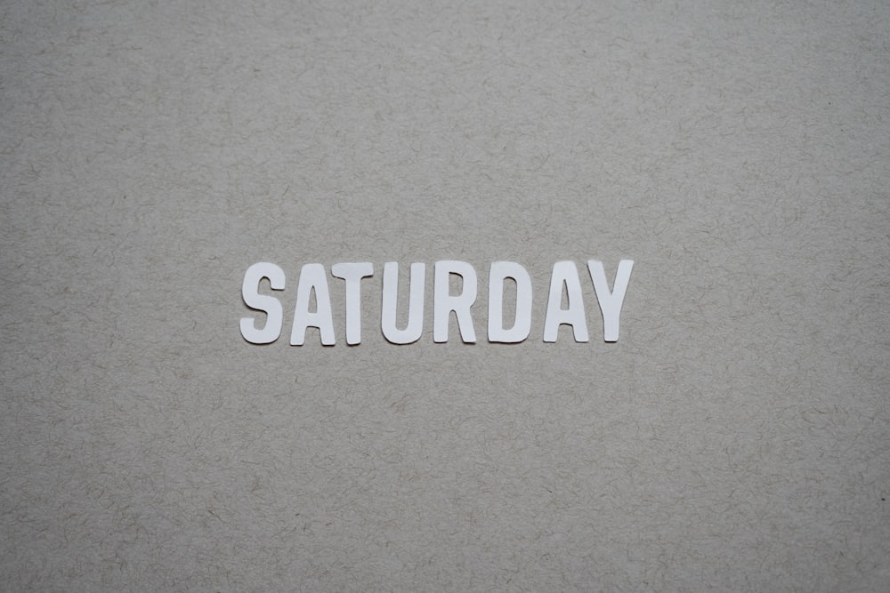 the word saturday written in cut out letters