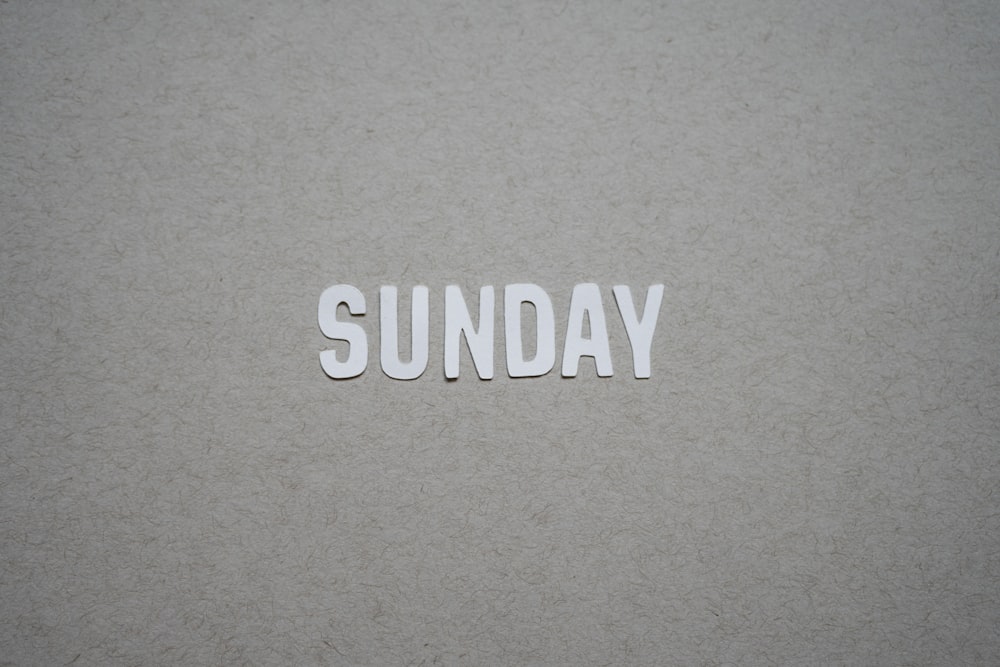 the word sunday written in cut out letters