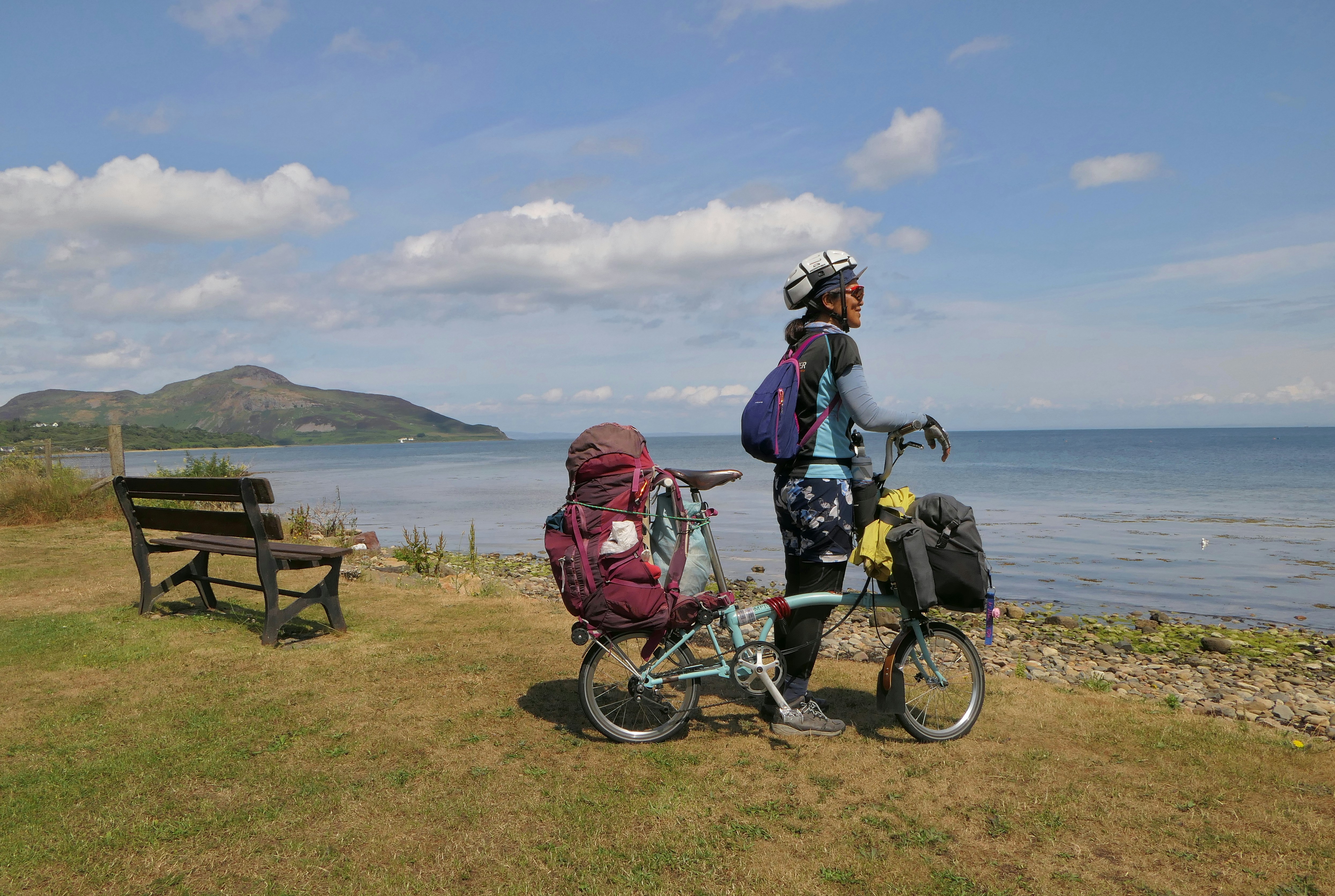 a couple of people that are standing next to a bike
