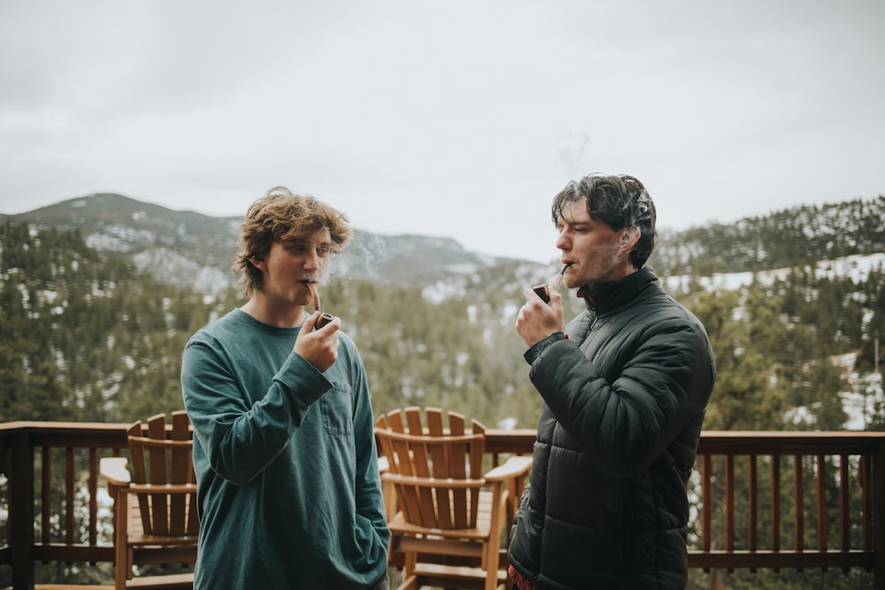 a couple of men standing next to each other