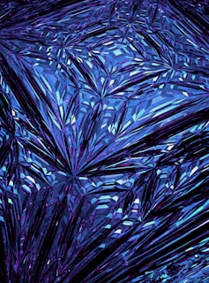 a blue background with a pattern of leaves