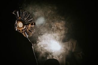 A warm, inviting ritual circle glowing softly against a black background, with golden hues reflecting the brand's palette.