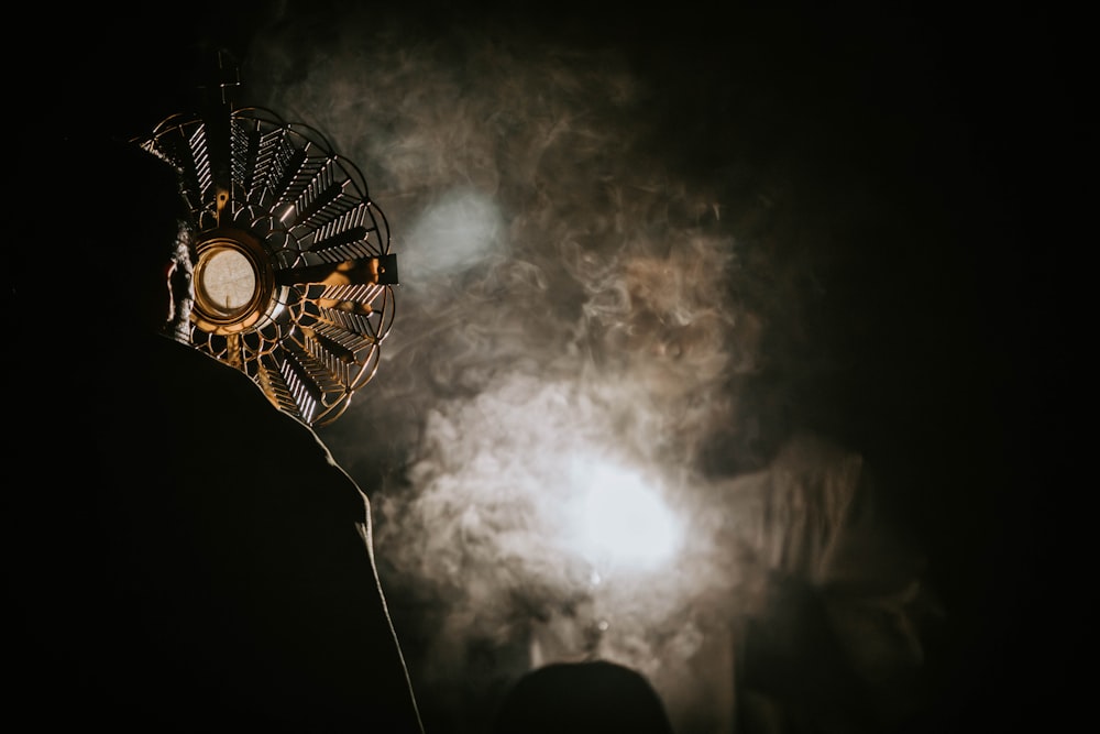a close up of a fan on a person's head
