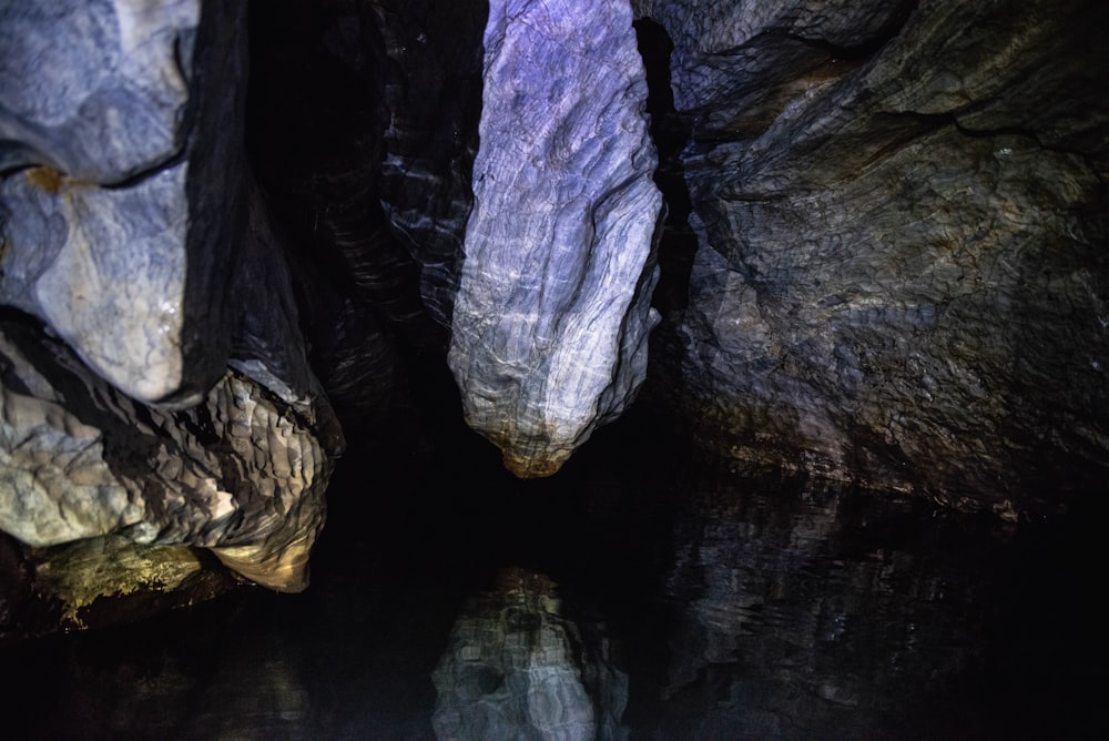 a small pool of water in a cave