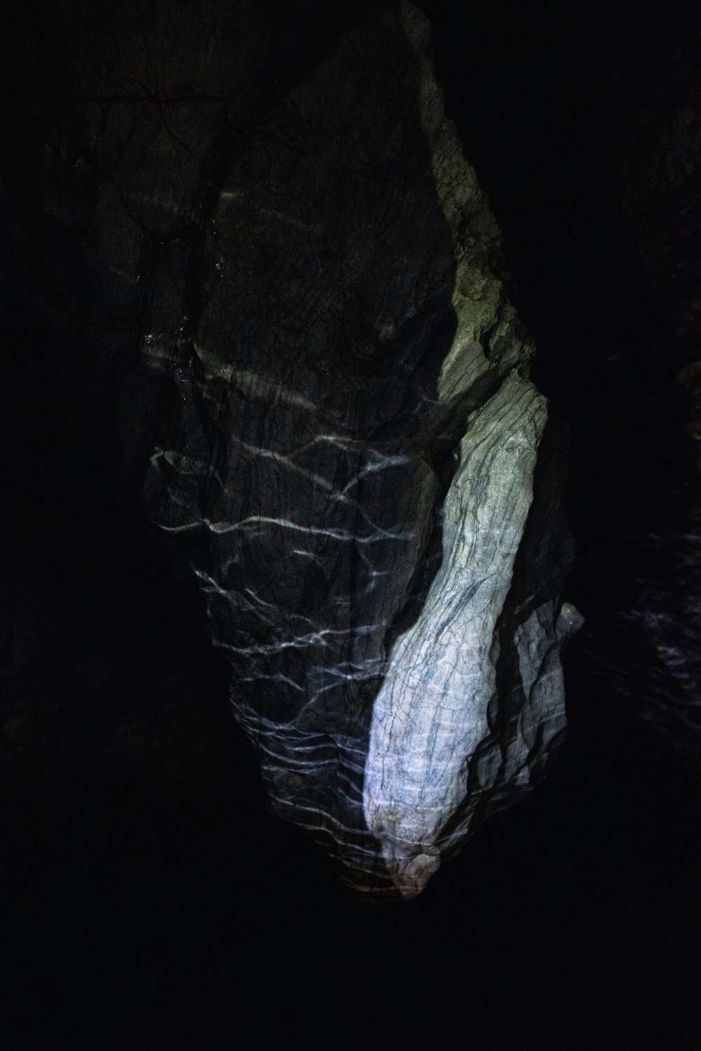 a large rock formation in a dark cave