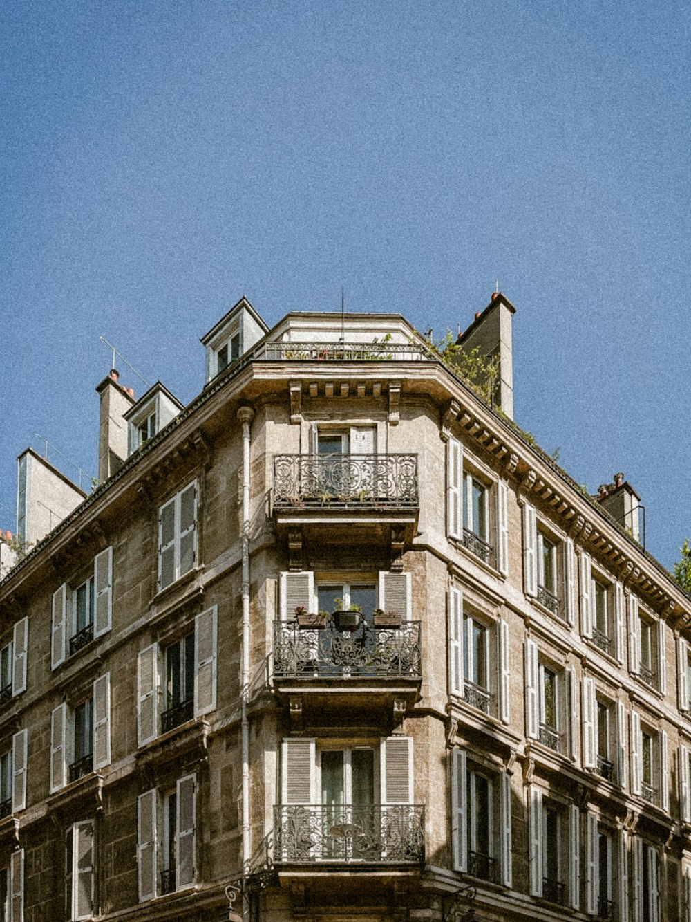 a tall building with balconies and balconies on the top of it