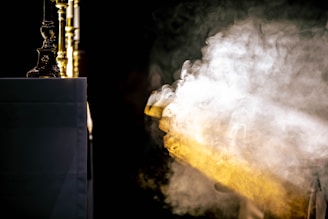 Ghostly mist swirling around a candlelit menu on a wrought iron stand.