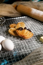 A warm kitchen scene with a pastry chef preparing delicate desserts.