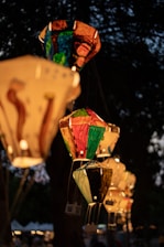 Close-up of colorful Korean festival lanterns glowing warmly at dusk.